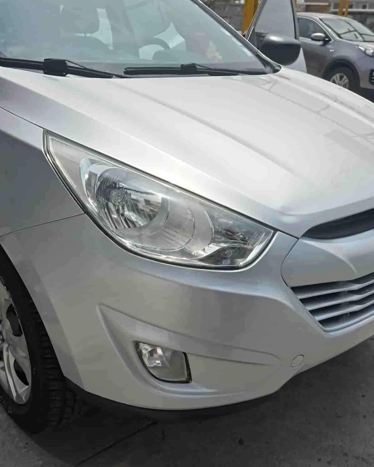 Taller de pintura automotriz en guayaquil para super SUV kia blanco